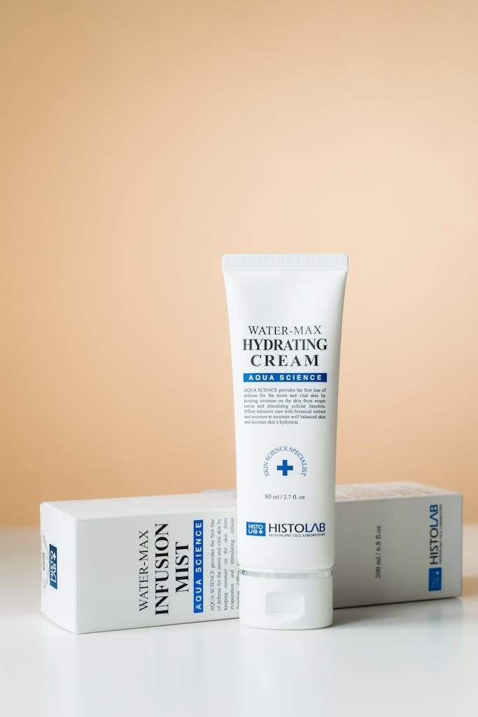 Close-up shot of Water-Max Hydrating Cream with yellow background.